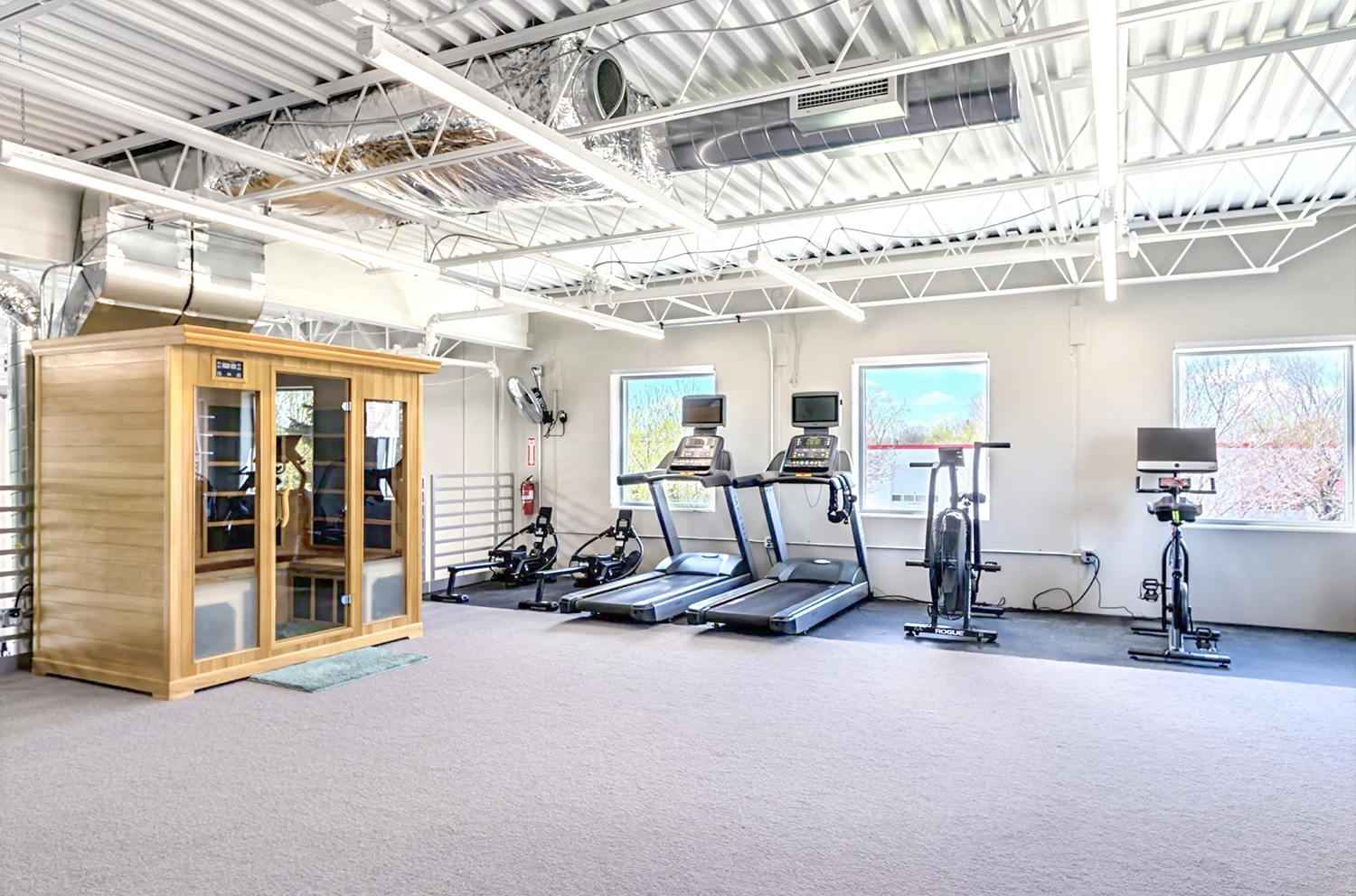 Dumbbells and benches in the Elevate weight room